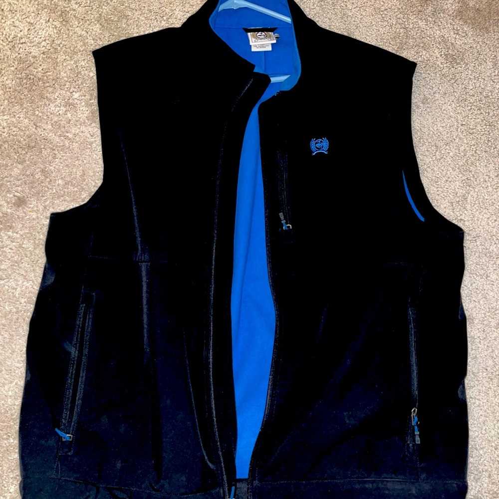 Men's Cinch Concealed Carry Vest. Black in color with Blue highlights.